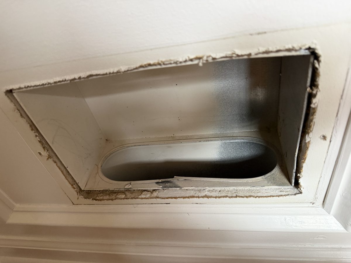The same register boot after cleaning, the metal and the duct opening clear